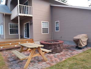 Picnic table, BBQ and fire pit.