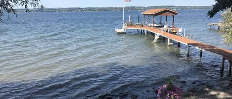 Permanent dock with lower dock & stone beach.