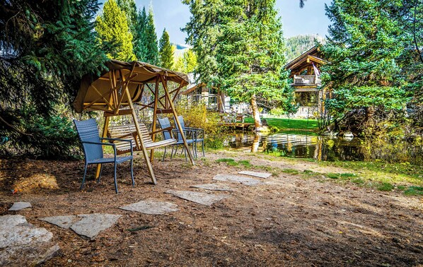 Backyard leading to the river. You can launch a kayak from here or go fishing.