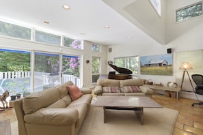 Family room; baby grand piano; fireplace