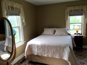 South bedroom ~ queen bed ~ full length mirror ~ luggage rack. 