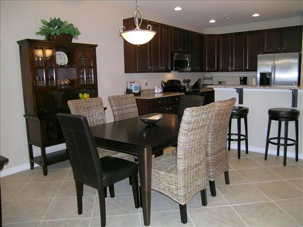 Dining Room(seating for 6) with hutch stocked with bar/glassware.