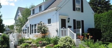 Front view of Cottage with terraced garden