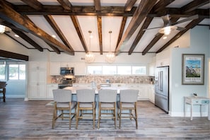 Plenty of seating at this huge Cambria Quartz topped kitchen island.