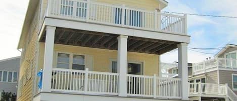 Elevated 1st floor 3 bedroom condo just steps from the beach. parking for 2 cars