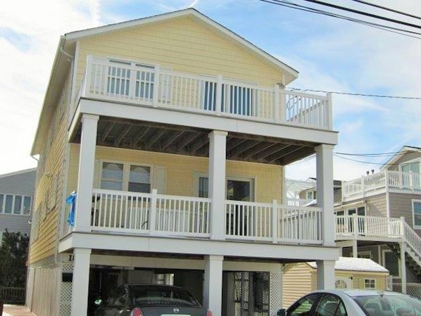 Elevated 1st floor 3 bedroom condo just steps from the beach. parking for 2 cars