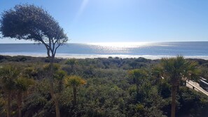 Enjoy the Kiawah beach right outside   your door while sitting on the balcony