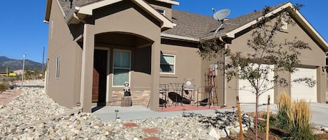 Front of Townhome, 1 car garage. Watch hummingbirds on Front patio!