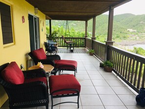 View From The Other End Of Private Deck Showing Chairs w/ Ottomans & Stone Table