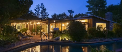 Summer nights are cool with a lighted patio and pool
