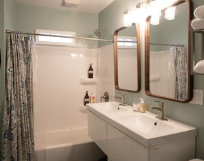 Second Floor Bathroom with towels, shampoo, conditioner, and body wash. 