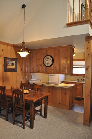 Dining table and kitchen.