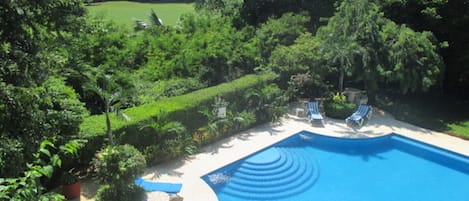 View of pool and golf course from our balcony.