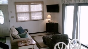 Cozy TV - den area next to kitchen and dining area.  Sleeper couch, ocean front!