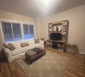 Front Living room with 32” tv, Roku, VCR, vintage PlayStation/games, books