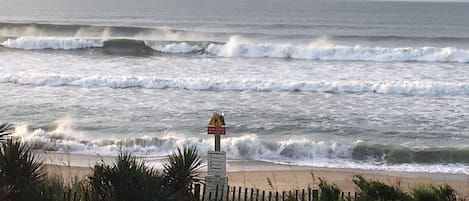 View from the deck by the dining area -Beautiful crashing waves along the beach