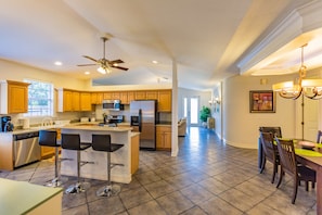 Open floor plan with cathedral ceilings, looking onto front entrance