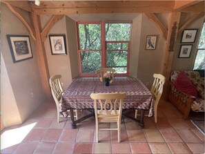 Dining table with easy access to kitchen and the outdoor grill. 