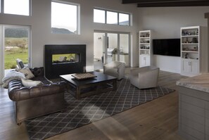 Views of mountains and vineyards with two sided gas fireplace.