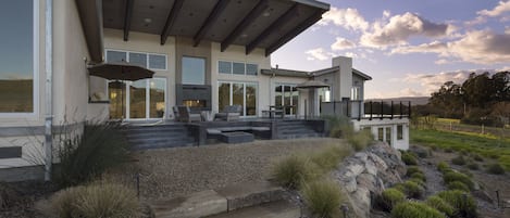 Expansive Veranda overlooking pool deck and estate planted pinot noir vineyards
