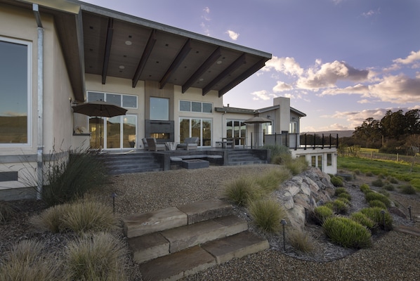 Expansive Veranda overlooking pool deck and estate planted pinot noir vineyards
