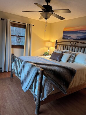 Luxury surrounds in this hickory king bedroom with private bath. Smart TV.