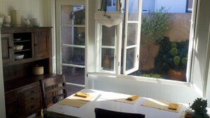 Dining with view out to Italian-insprired courtyard
