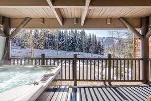 Watch the snowcats from your private hot-tub.