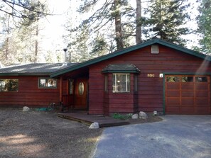 Front of cabin showing driveway and garage