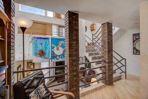 Kitchen/dining room looking at living room below. Hot Tub deck above. 