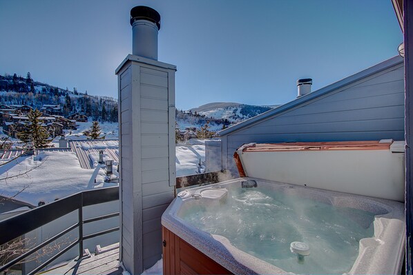 Hot Tub with Mountain views . Chimney has been removed, for an even better view.