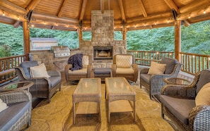 Cozy up and enjoy hanging out by the outside fire while grilling your favorite meals!