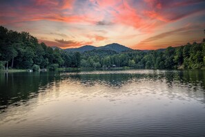 Enjoy sitting on the dock while the sun is going down over the lake and mountains