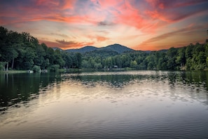 Enjoy sitting on the dock while the sun is going down over the lake and mountains