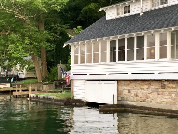 The lakefront  porch is a defining feature of this cottage. 