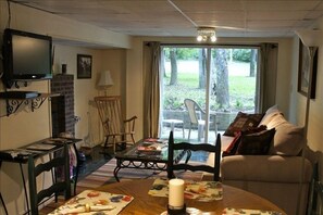 The first floor sitting area with a door overlooking the front lawn