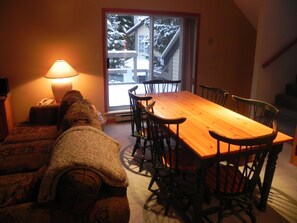 Dining area seats 8. Patio with BBQ and Hot tub behind