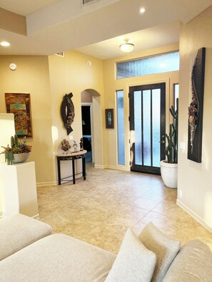 Main Entry With Tastefully Decorated Artwork and Sculptures