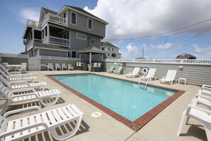 Exquisite oceanfront pool with a Tiki bar and a private path leading directly to the beach.