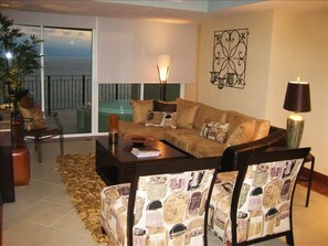 The living room opens onto the oceanfront view balcony