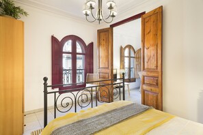 Master bedroom and partial view of living room