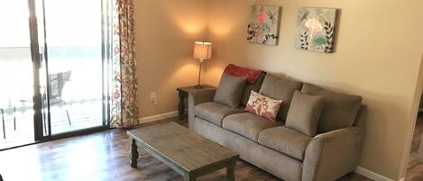 Oak laminate flooring and a Lazy Boy pull-out couch new in Aug. 2018.