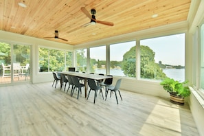 Sunroom dining for 12, plus more chairs and a small table on side, w/great view