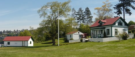 Park grounds, cottage rental on right, History Research Center, and Boat House.