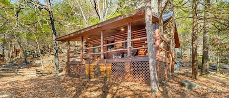 This native themed cabin sits among whispering pines and Ozark rock formations.