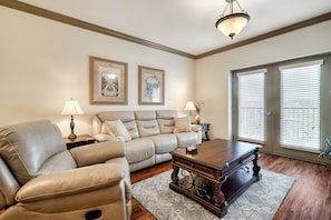 Living room with couch that has electric
recliners on both ends 