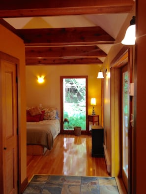 French doors open to large side deck. Heated slate floors. Hardwood floors.