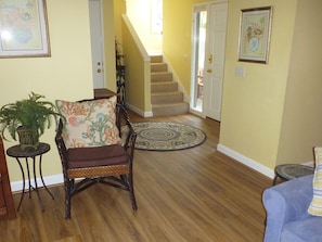 From Living Room looking toward front door and stairs. New luxury vinyl flooring