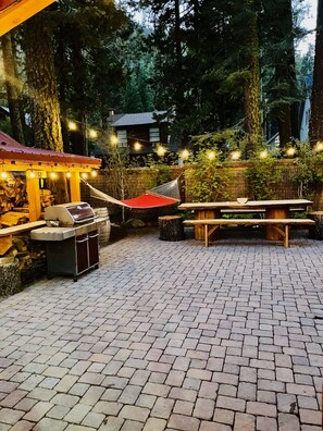 Outdoor dining on hand carved log dining table or bistro dining on deck.