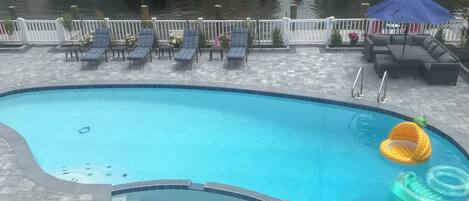 Reimagined pool area. New paver, landscaping and patio furniture 